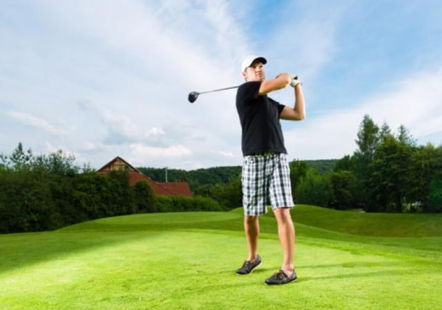 Golfer making a shot in a distance