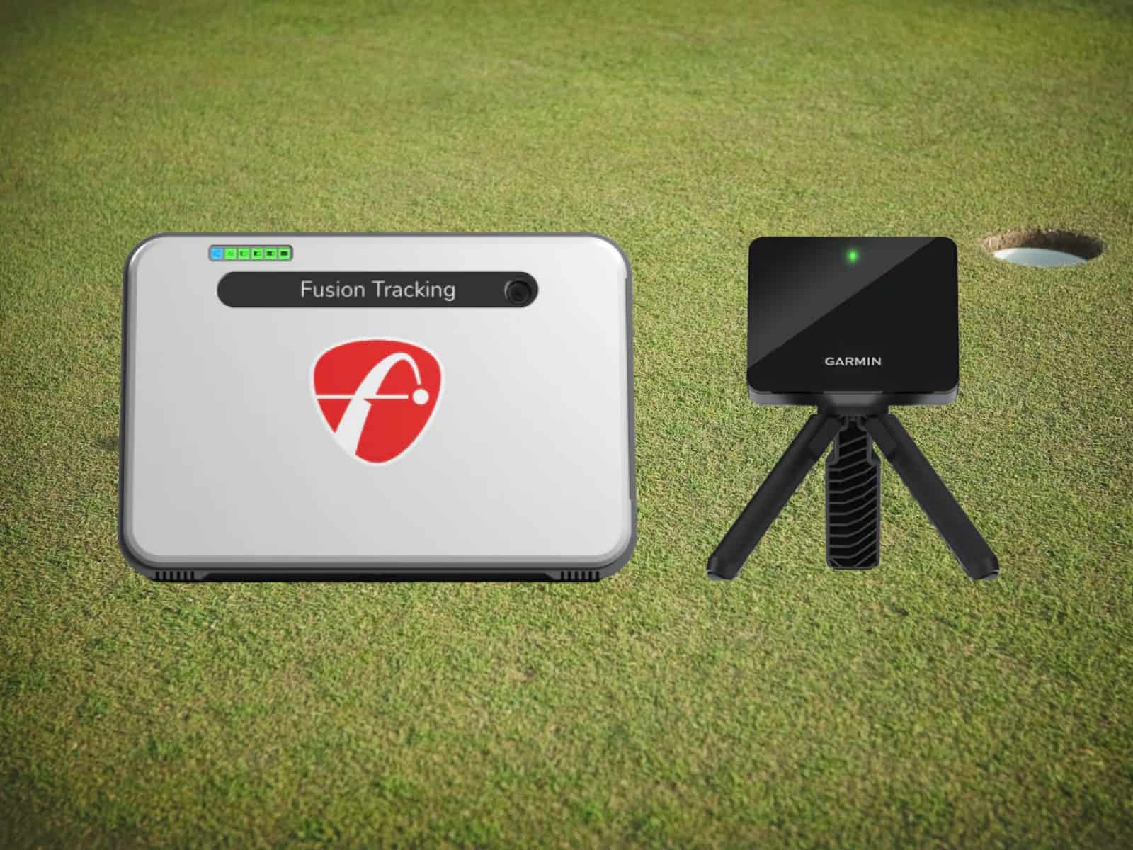 High-tech golf simulator equipment including Fusion Tracking device and Garmin motion sensor on indoor green for realistic golf practice and swing analysis.