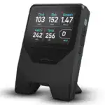 Close-up of the Shot Scope LM1 radar launch monitor displaying shot data including club speed, ball speed, smash factor, carry distance, and total distance for golf practice.