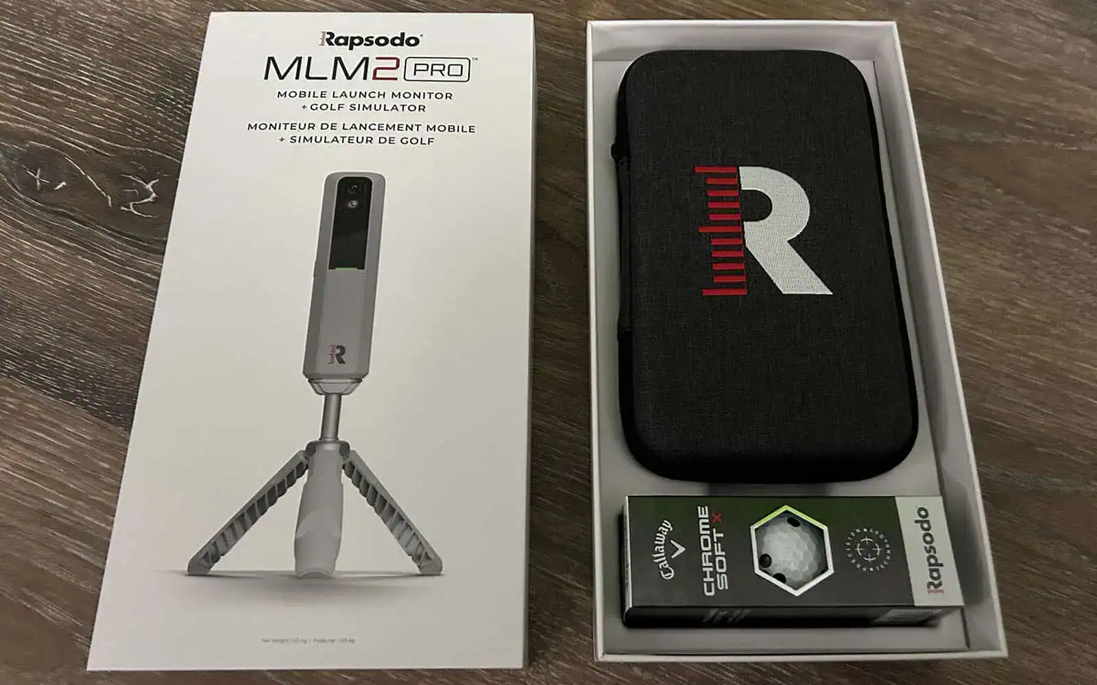 Portable golf launch monitor device by Rapodo with tripod stand, designed for accurate swing analysis and shot tracking for golf enthusiasts.